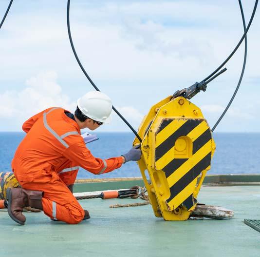 engineer inspecting crane hook